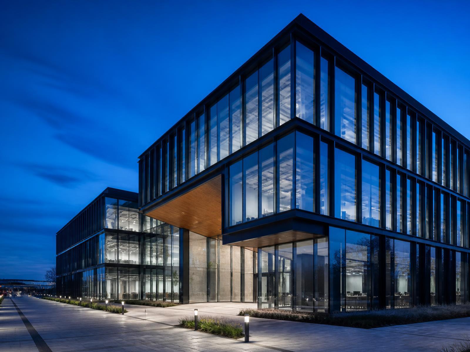 Modern glass office building at dusk